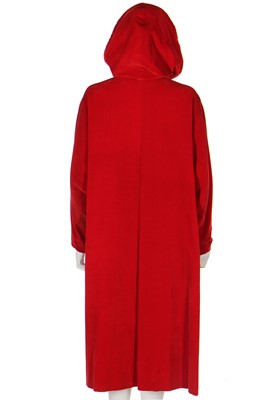 Lot 91 - A Schiaparelli red velvet swing-coat with hood, late 1950s