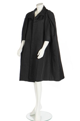 Lot 389 - A Balenciaga couture black slubbed-silk tent-coat, 1954-55