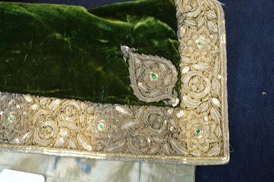 Lot 280 - A boy's embroidered olive-green velvet court coat, Indian, late 19th century
