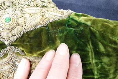 Lot 280 - A boy's embroidered olive-green velvet court coat, Indian, late 19th century