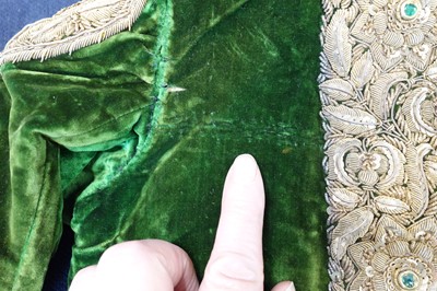 Lot 280 - A boy's embroidered olive-green velvet court coat, Indian, late 19th century