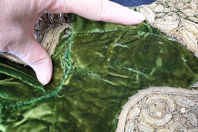 Lot 280 - A boy's embroidered olive-green velvet court coat, Indian, late 19th century