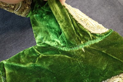 Lot 280 - A boy's embroidered olive-green velvet court coat, Indian, late 19th century