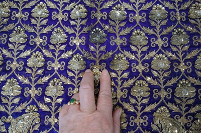 Lot 276 - A boy's elaborately embroidered and bejewelled purple satin waistcoat, Indian, late 19th century