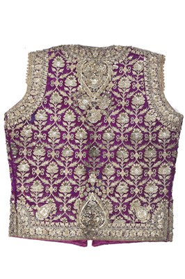 Lot 276 - A boy's elaborately embroidered and bejewelled purple satin waistcoat, Indian, late 19th century