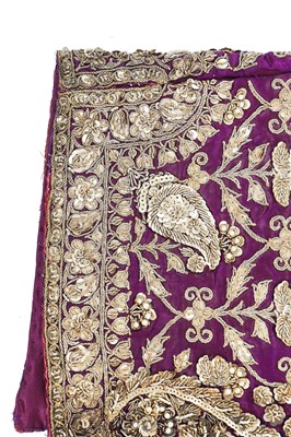 Lot 276 - A boy's elaborately embroidered and bejewelled purple satin waistcoat, Indian, late 19th century