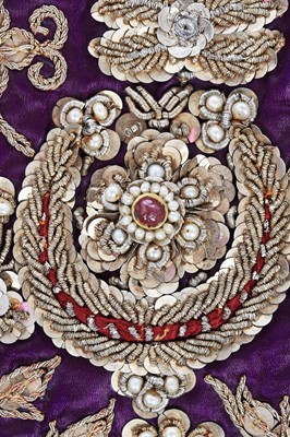 Lot 276 - A boy's elaborately embroidered and bejewelled purple satin waistcoat, Indian, late 19th century