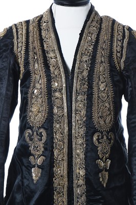 Lot 287 - A young man's black satin coat, Indian, circa 1910