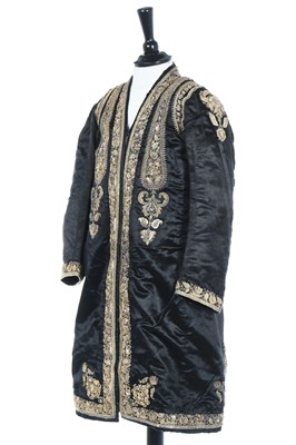 Lot 287 - A young man's black satin coat, Indian, circa 1910