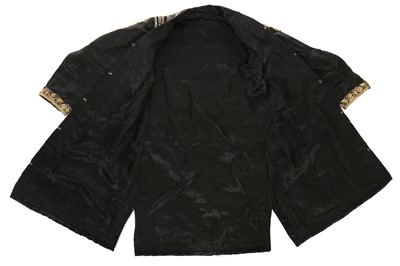 Lot 287 - A young man's black satin coat, Indian, circa 1910