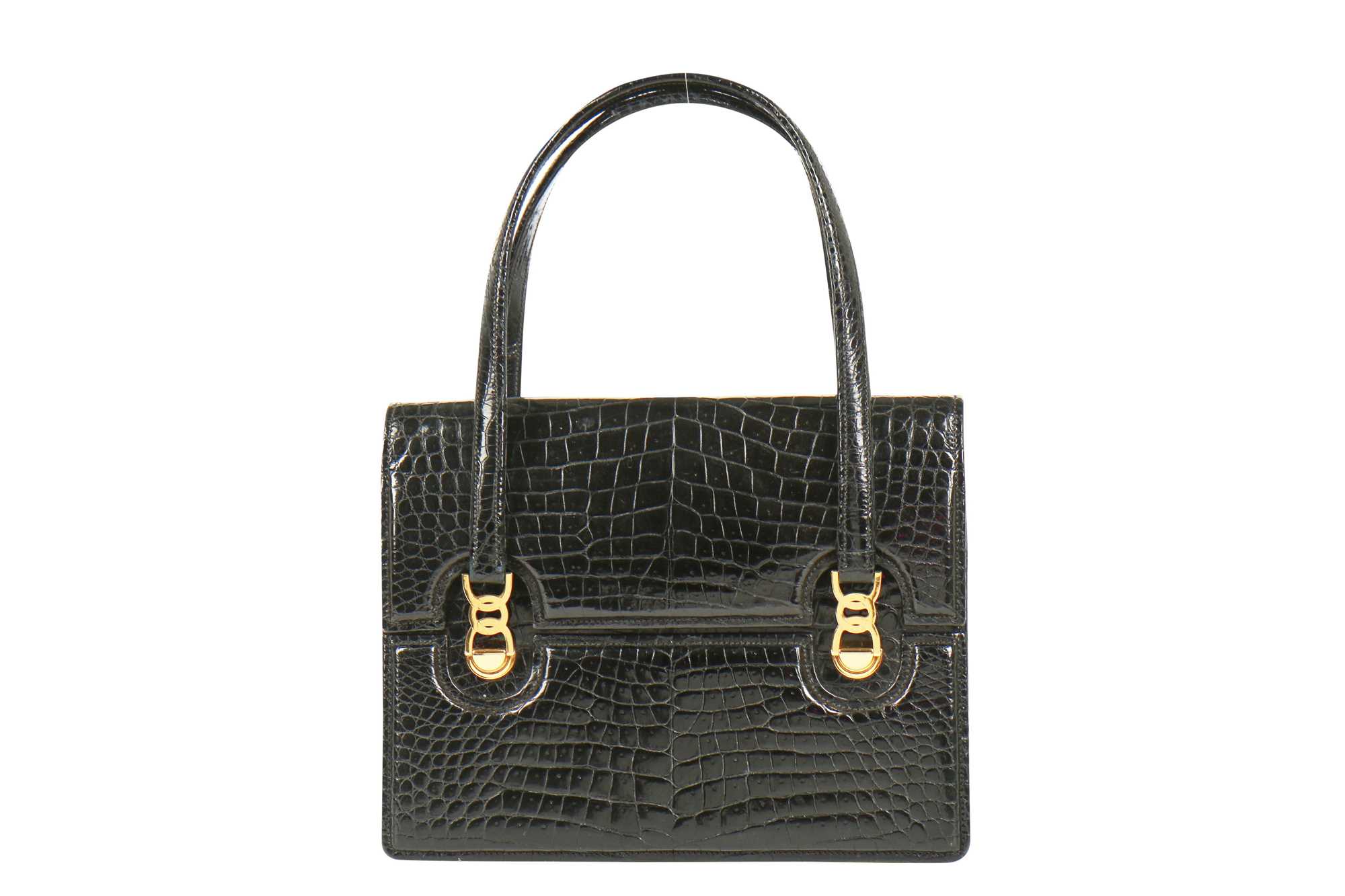 Click for high resolution Lot 2 - A Gucci black crocodile handbag, 1960s