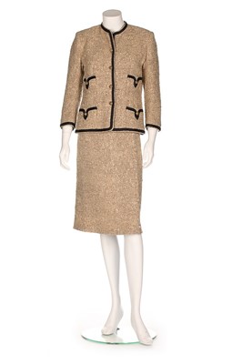 Lot 146 - A Chanel couture oatmeal tweed suit, circa...