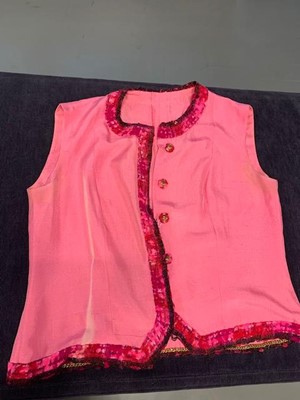 Lot 8 - A Chanel couture shocking-pink tweed suit, Spring-Summer 1966
