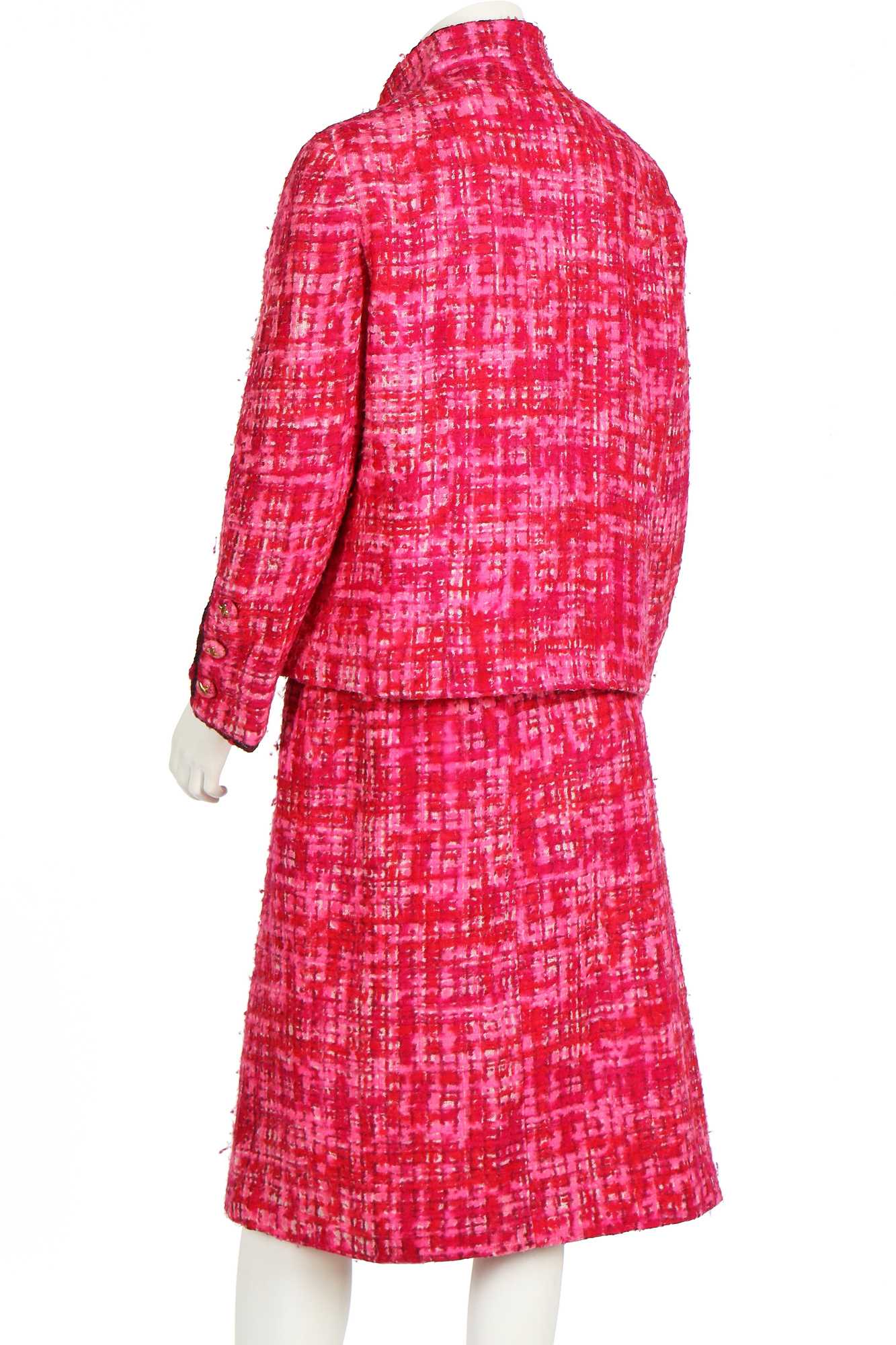 Lot 8 - A Chanel couture shocking-pink tweed suit,