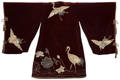 Lot 237 - A burgundy velvet robe appliquéd with large gilt-thread embroidered cranes amongst lily pads, Japanese, probably 1910s