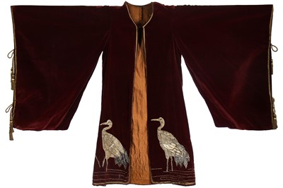 Lot 237 - A burgundy velvet robe appliquéd with large gilt-thread embroidered cranes amongst lily pads, Japanese, probably 1910s