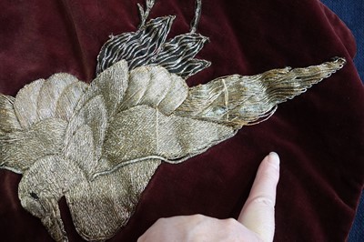 Lot 237 - A burgundy velvet robe appliquéd with large gilt-thread embroidered cranes amongst lily pads, Japanese, probably 1910s