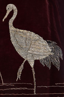 Lot 237 - A burgundy velvet robe appliquéd with large gilt-thread embroidered cranes amongst lily pads, Japanese, probably 1910s