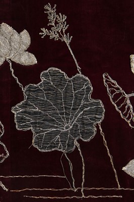 Lot 237 - A burgundy velvet robe appliquéd with large gilt-thread embroidered cranes amongst lily pads, Japanese, probably 1910s