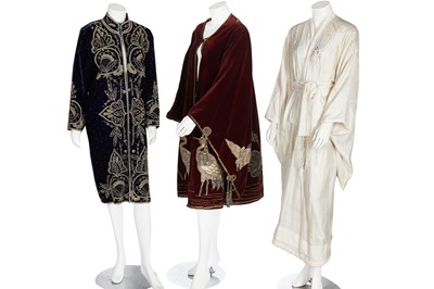 Lot 237 - A burgundy velvet robe appliquéd with large gilt-thread embroidered cranes amongst lily pads, Japanese, probably 1910s