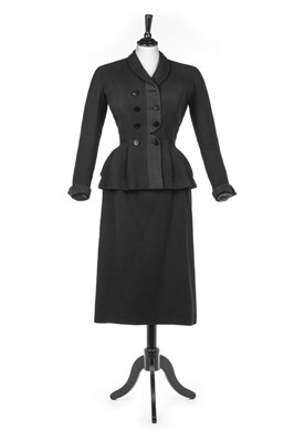 Lot 157 - A Pierre Balmain couture black wool suit,...