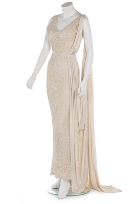 Lot 158 - A Pierre Balmain couture ivory guipure sheath,...