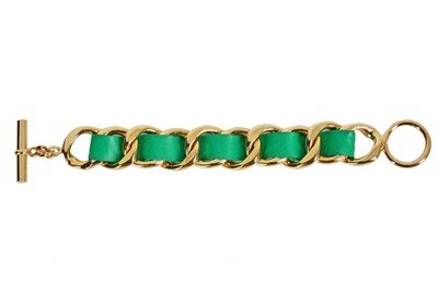 Lot 23 - A Chanel chunky gilt chain and woven green leather bracelet, 1987
