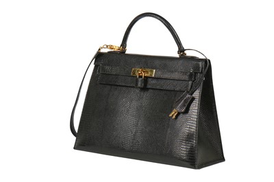 Lot 4 - An Hermès black niloticus lizard Kelly 32, 1989