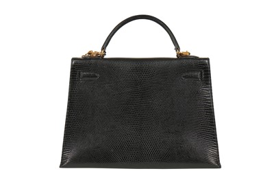Lot 4 - An Hermès black niloticus lizard Kelly 32, 1989