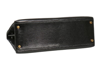 Lot 4 - An Hermès black niloticus lizard Kelly 32, 1989
