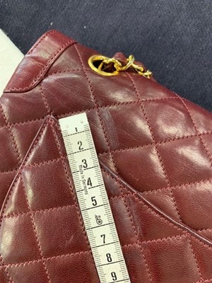 Lot 2 - A Chanel bordeaux-red quilted lambskin leather flap bag, 1980s