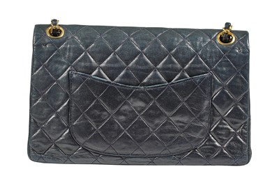Lot 8 - A Chanel navy quilted lambskin leather flap bag, 1980s