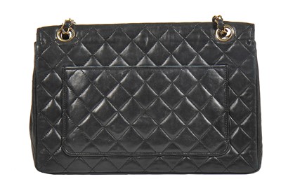 Lot 6 - A Chanel black quilted lambskin leather flap bag, 1980s