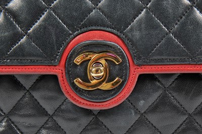 Lot 6 - A Chanel black quilted lambskin leather flap bag, 1980s