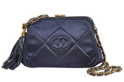 Lot 5 - A Chanel quilted midnight-blue satin evening bag, 1980s
