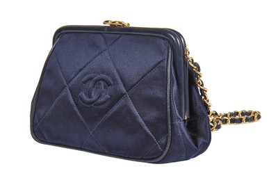 Lot 5 - A Chanel quilted midnight-blue satin evening bag, 1980s