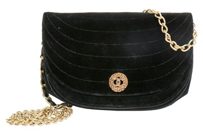Lot 10 - A Chanel quilted black velvet evening bag, 1980s