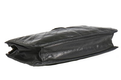 Lot 13 - A Chanel quilted black lambskin leather pochette, 1986-88