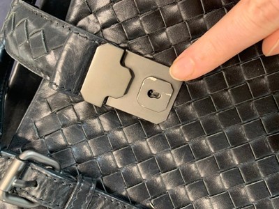 Lot 38 - A Bottega Veneta black leather handbag, 2000s