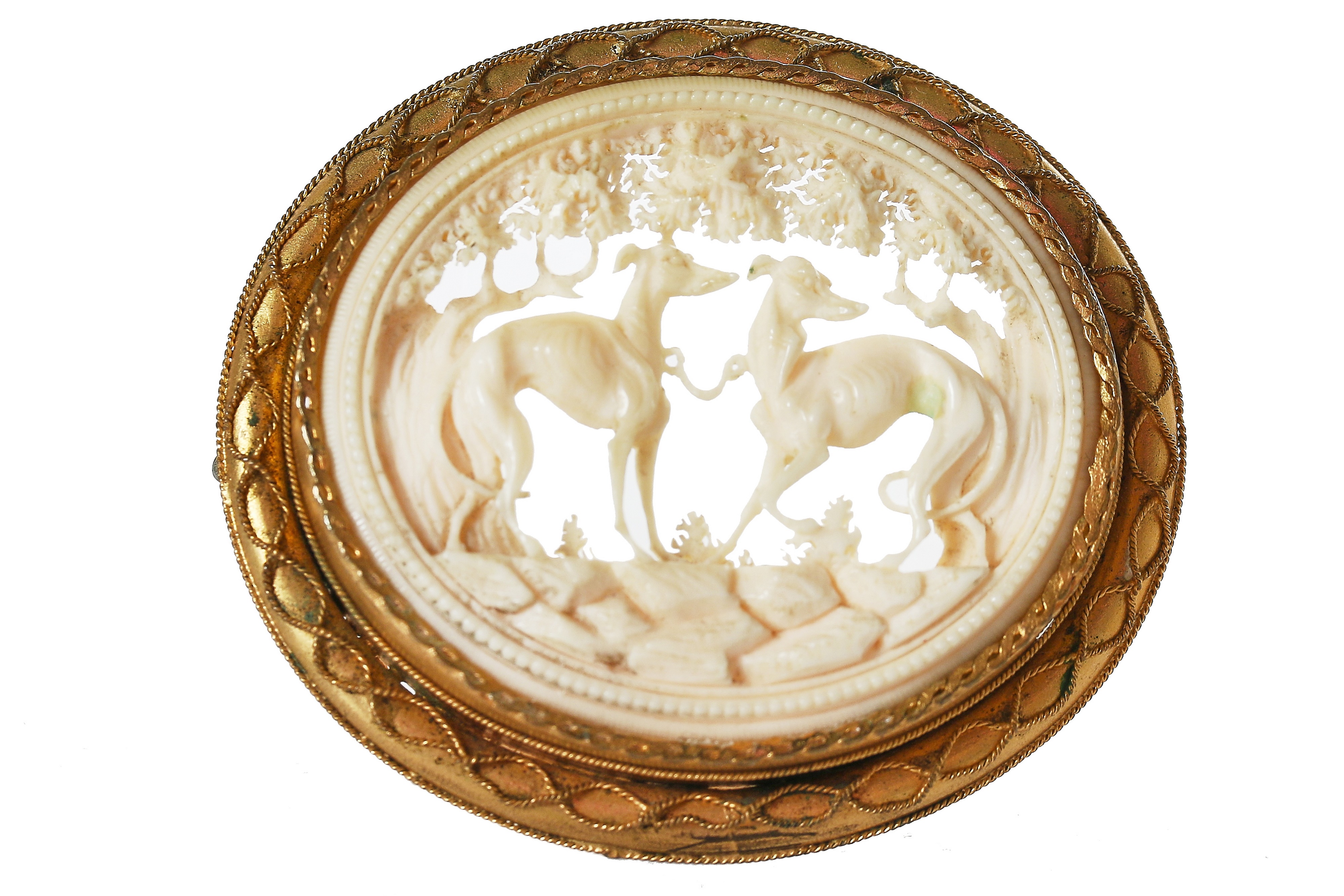 Lot 30 A finelycarved ivory brooch set in a gilt
