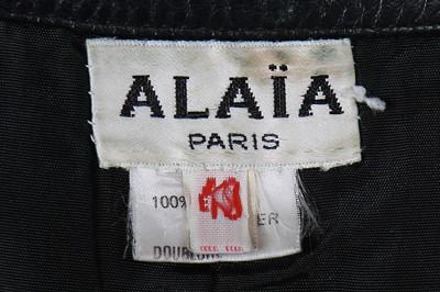 Lot 124 - Two Azzedine Alaïa black leather skirts, 1980s-early 1990s