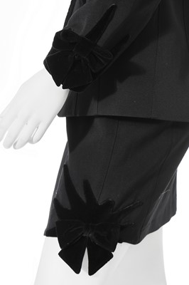 Lot 122 - A Thierry Mugler black wool suit with velvet 'starburst' and bows, late 1980s-early 1990s