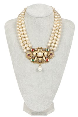 Lot 13 - A fine Chanel three-strand 'pearl' necklace with bejewelled gilt plaquette, 1971-1981