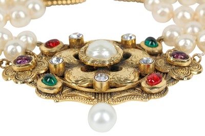 Lot 13 - A fine Chanel three-strand 'pearl' necklace with bejewelled gilt plaquette, 1971-1981