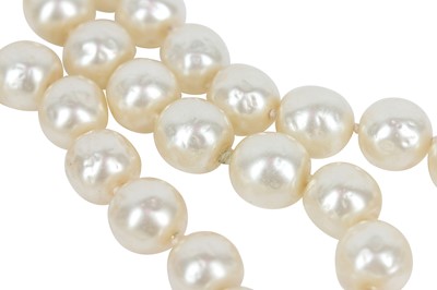 Lot 13 - A fine Chanel three-strand 'pearl' necklace with bejewelled gilt plaquette, 1971-1981