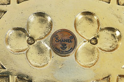 Lot 13 - A fine Chanel three-strand 'pearl' necklace with bejewelled gilt plaquette, 1971-1981