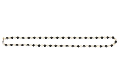 Lot 19 - A Chanel sautoir of black and white 'pearls', 1981