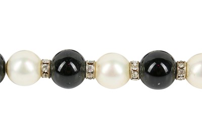 Lot 19 - A Chanel sautoir of black and white 'pearls', 1981