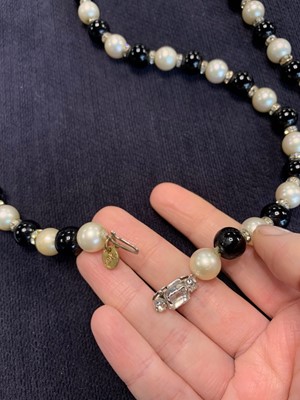 Lot 19 - A Chanel sautoir of black and white 'pearls', 1981