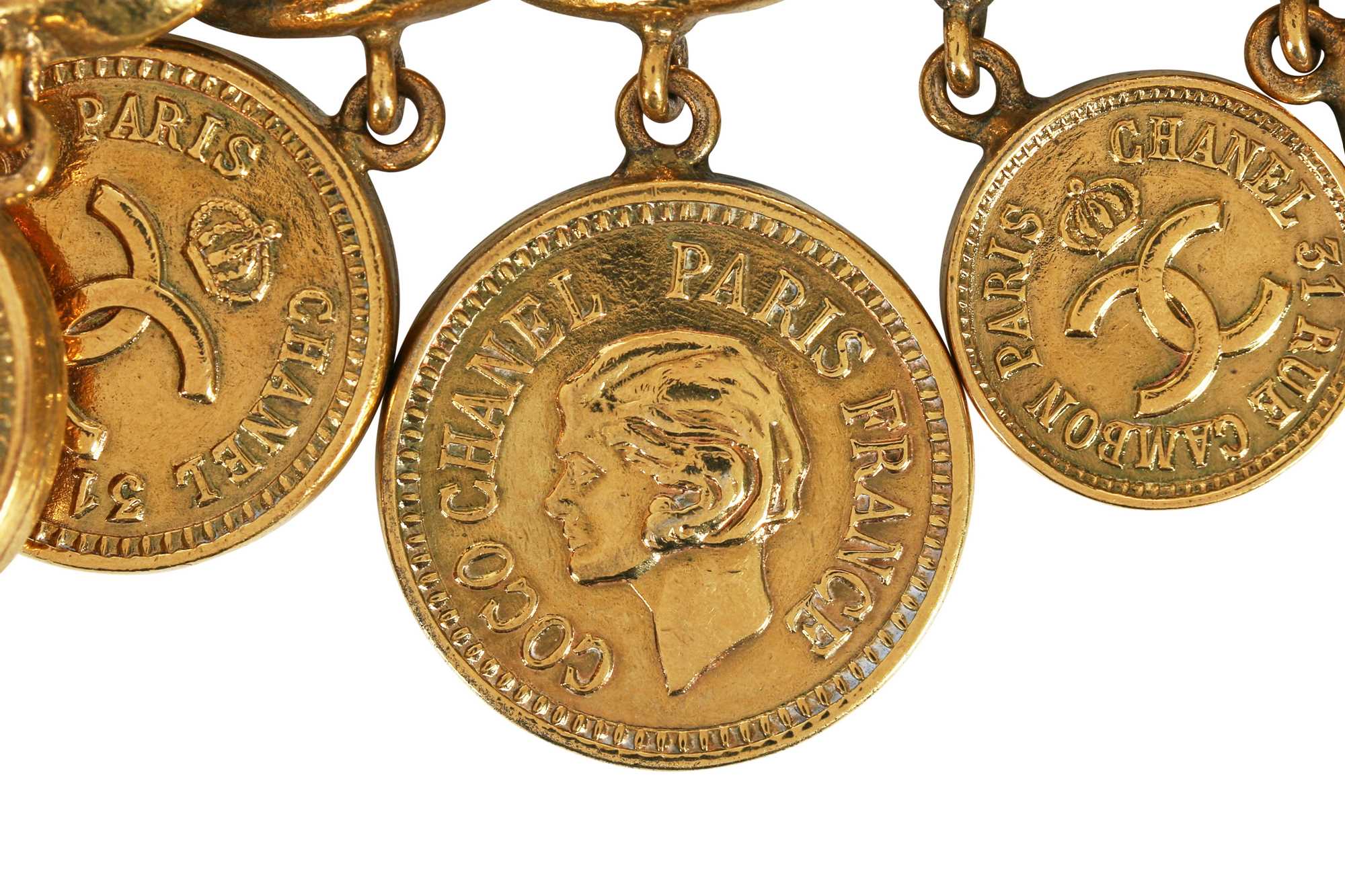 Click for high resolution Lot 16 - A fine Chanel gilt 'coin' charm bracelet, probably 1970s